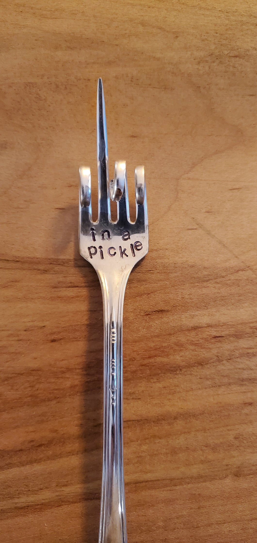 in a pickle fork (2nd tine extended)